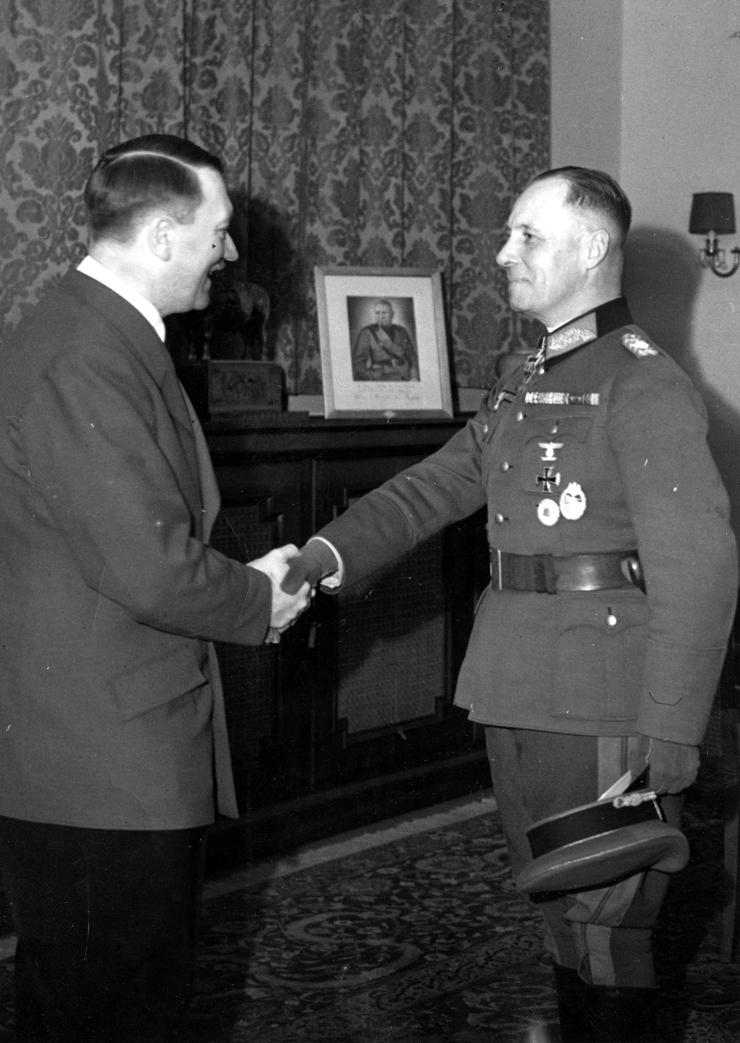 Adolf Hitler awards Erwin Rommel with the Knight's Cross of the Iron Cross
